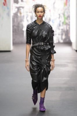 Preen by Thornton Bregazzi: Tomboy tailoring met romantic vintage ruffles at Preen. Delicate floral prints clashed against outfits in purple,red and mustard.