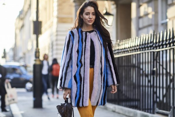 Coloured fur stripes and flared mustard trousers bring playful colour to this daywear look.
