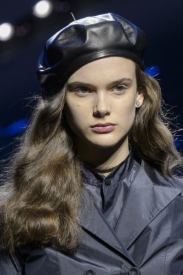 Black leather berets designed by milliner Stephen Jones exuded a commanding military vibe.