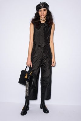 Chiuri counterbalanced masculine details such as the silhouette of this black boiler suit with feminine touches such as a chic pussy bow and shiny taffeta fabric.