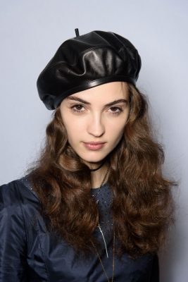 Backstage makeup was kept to a minimum and hair was left to flow gently out from under berets with the focus kept on natural beauty.