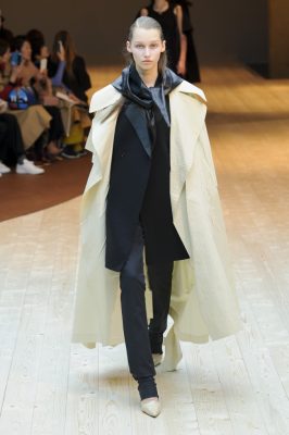 Céline: Proportion was carefully considered with slimline stirrup trousers counterbalanced voluminous oversized trench coats. As always, accessories were a key part of the collection, slick ankle boots of varying heel heights featured in cream and gold, while a bigger is better aesthetic was applied to bags with oversized totes and shoulder bags accompanying the models down the runway.