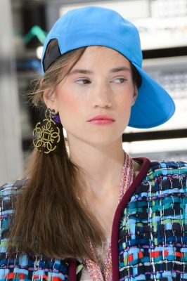 Chanel. While Gabrielle Chanel could certainly not have predicted her clients in hoop earrings, Monsieur Lagerfeld’s take on the trend is a perfect example of preppy-elegance. We, however, would stay away from the basketball cap.
