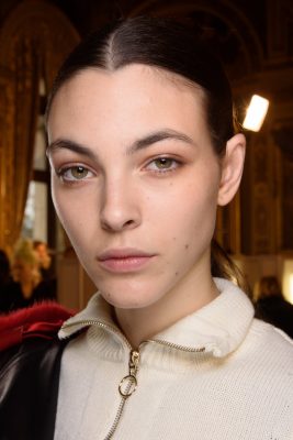 At Lanvin’s autumn/winter17 Paris show, a quiet and soft elegance was achieved with fresh, light complexions, as well as natural, arched brows and neat, swept-back up-dos.