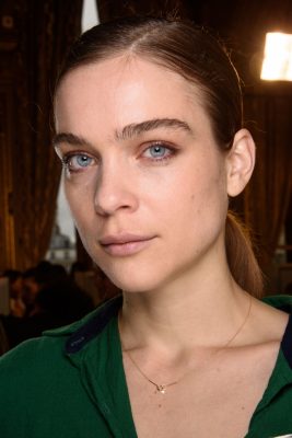 Lanvin: Take beauty cues from Lanvin for a pared-back day look. Opt for a dewy complexion with light foundation and highlighter and add a light dusting of rose or pink shadow over lids. Finish the look with a slick ponytail parted to the side