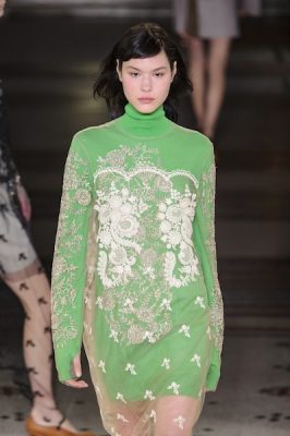 Stella McCartney. The designer elevated the mood of her pieces for autumn with an interesting foray of lacework meshed with jumpers and tulle that respectfully referenced orientalism and eastern motifs. These two points of inspiration created a new allure in daywear pieces such as an opal green top worn underneath a silk tulle embroidered shift.