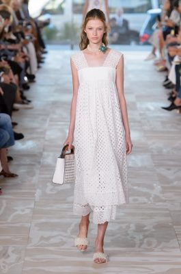 Tory Burch. Always remember to stay away from traditional forms of lace when looking at white dresses. Instead, opt for eyelet lace, which appeard in delicate minimalist shapes such as circular designs and five petal floral designs. Thick straps in this particular lace create a sense of eternal summer. Pair with a slim Saint Laurent jacket for weekend cool.