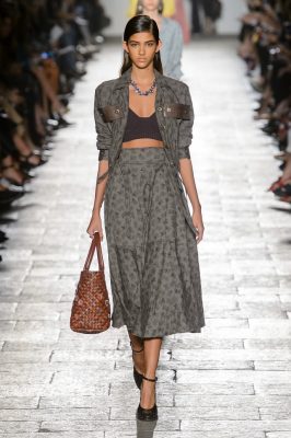 The Bralet: Don't shy away from the bralet. This versatile top can be worn with a high-waisted skirt or jeans with a summer jacket layered over (as seen here at Bottega Veneta) or show it off by reverse-layering over a white tee.