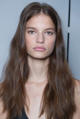 Beach babe: Channel Vera Wang's beach soft beach waves by blow drying hair and twisting into loose curls with a flat iron.