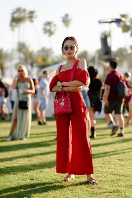 Blogger Aimee Song sported a coordinating red crop top and culottes, accessoried with a Dior handbag and sunglasses.