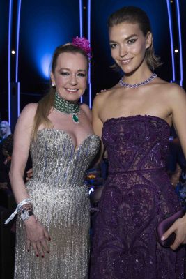 Chopard’s co-president Caroline Scheufele poses with brunette beauty Arizona Muse who wears a deep purple strapless Elie Saab autumn/winter17 gown with the maison’s jewels.