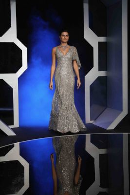 Isabeli Fontana wears galactic with a touch of diamonds in a dazzling silver metallic mermaid-tailed dress.