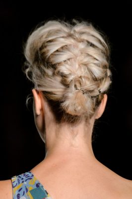 Leitmotiv | The trick to achieving a thick, eye-popping fishtail? Ensure the braid isn’t too perfect by roughing up with texture spray and a fine-toothed comb. Keep it in place with a firm-hold hairspray. Keep a few wispy curls loose towards the front to frame the face.