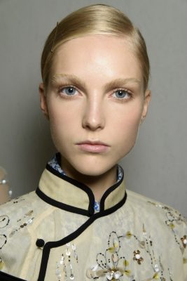 The Skin | Flawless skin, groomed natural brows and subtle eyes are presented for Prada thanks to expert makeup artist Pat McGrath. Again, a beautiful look for those brides who want their focal point to be a statement hairstyle.
