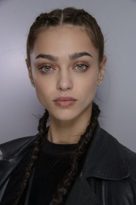 Braids are a durable hairstyle that offer structure and sophistication. While they look great when first created, they look just as good when worn in with a few loose fragments.Emporio Armani