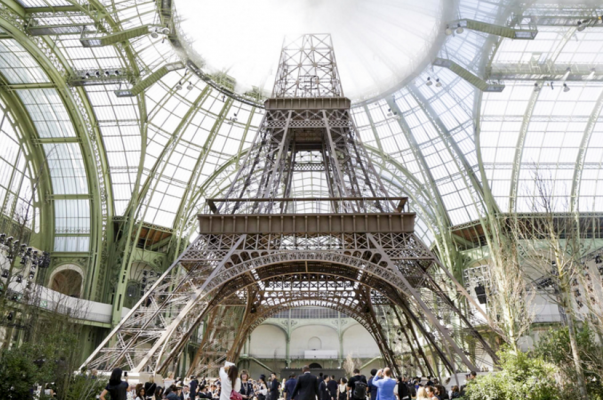 The large-scale construction of the Eiffel Tower was anything but ordinary and loomed magically above the runway models beneath it.