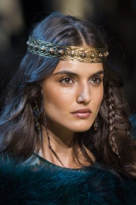 The Headpiece: After several seasons, Elie Saab has swapped his signature eveningwear for layers of tulle and heavy swaths of velvet, which transformed the designer's modern aesthetic into a romantic and supernatural fairytale. Gold wreaths perched atop flowing tresses added an otherworldly dimension to the graceful ensembles.