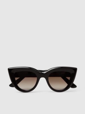 Gradient lenses and an exaggerated cat-eye shape make Ellery's Quixote sunglasses super cool. Available at the Modist