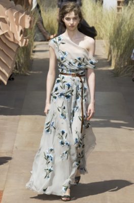 Delicate painterly cornflower blooms embroidered with silk thread lent colour and charm to a dove grey chiffon ballgown.