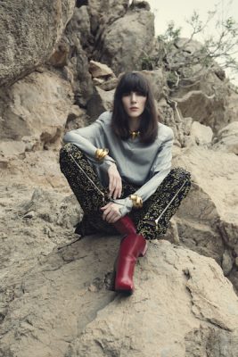 It might sounds ridiculous but with seasonless dressing being the recognised mode of dress, wearing a shoulder padded top in light silk on an off-road holiday isn’t exactly improbable. Go all the way with printed trousers complete with glinting gold zippers and burgundy boots. All LOUIS VUITTON.