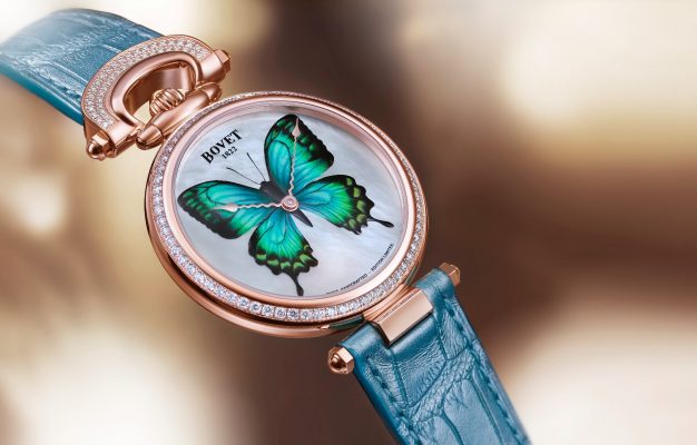 Bovet unveils an innovative technique that brings a new dimension to the decorative arts with its Château de Môtiers 40 model. The red gold watch features a bow and bezel set with 109 diamonds, while a mother-of-pearl dial boasts a miniature ‘butterfly’ in sky-blue, charcoal-black and neon-green.