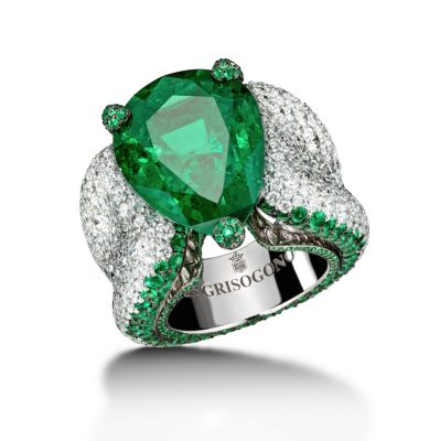 A spectacular luxury creation by De Grisogono, this statement ring features a staggeringly-big showcase emerald, whose shine is emphasised by a thick band mottled with diamonds.