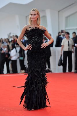 Renata Kuerten wears black gown with feathers by Alberta Ferretti at the opening ceremony of the 74th Venice Film Festiva