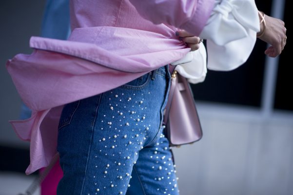 Embrace a softer side by selecting denim pieces with feminine embellishments such as pearls and crystals. Pair with powdered pinks and billowy blouses to nail the look.