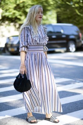 Fashion's modest movement strides its way into autumn. Shake up convention by pairing a flowing long dress with athleisure-style sliders for off-duty wear