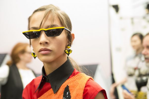 Prada paired its nonconformist attitude with edgy updos that feature choppy fringes and cool Nineties vision.