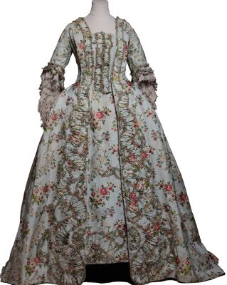 This silk dress with a floral chain motif and decorative trimmings (c. 1770) would have belonged to a reader to Marie Antoinette, possibly the young Sidonie Laborde, who remained in the service of the queen until her death. During their walks in the parks, places to see and be seen, ladies of the French aristocracy in the late 18th Century wore ‘pastoral clothes’ to create harmony with what was then perceived as the supreme refinement of the landscape.