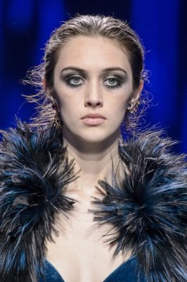 Fallen angels at Elie Saab | It's simple: take your go-to smoky eye and extend outwards. Add a wash of metallic - gold is the safe option but a deep purple or pink are also worth experimenting with - and a deep brown or black to create the extension towards the brow and temple. Finish with a smudge of black kohl