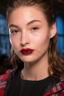 Lustrous Lips: High shine pouts are back, this time in shades of vivid red. Use a scrub to remove dead skin then define lips with a liner for a longer-lasting effect, before applying gloss. Image: Giambattista Valli.