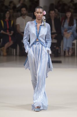 Alexis Mabille: Titled Paris Blossom, Alexis Mabille utilised quintessentially Parisian stripes which were emblazoned on everything from dresses to skirts. Romantic floral headpieces gave an ode to the whimsical, balancing out masculine suiting and complementing soft shades of pink and blue