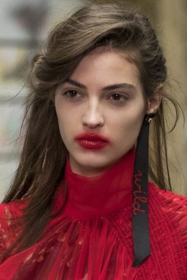 Vamp lips at Preen | This is the only occasion where a lipstick smudge becomes a legitimate beauty look, so wear with aplomb. Apply a red liner and lipstick (Tom Ford or Chanel are our go-to's), top with a sheer, glassy gloss and then smudge the outer edges. The 'technique' is rough and ready - smudge the outer lip but without too much attention paid.