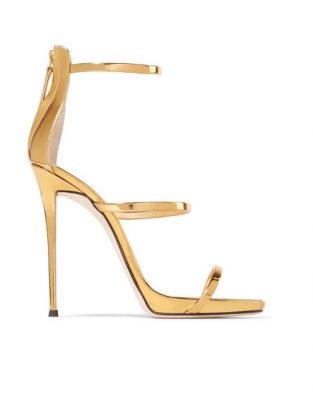 Nothing suits the glamorous tone of romantic red like a splash of gilded footwear. Giuseppe Zanotti's Harmony sandals have a three-strap structure that elegantly frames your feet. They've been made in Italy from high-shine gold leather. Set on a slender stiletto heel, the contrasting block colour balances the boldness of the scarlet