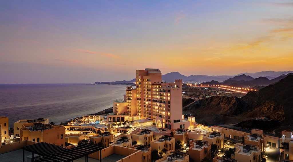 The hotel faces both the Gulf of Oman and the Hajar Mountains 