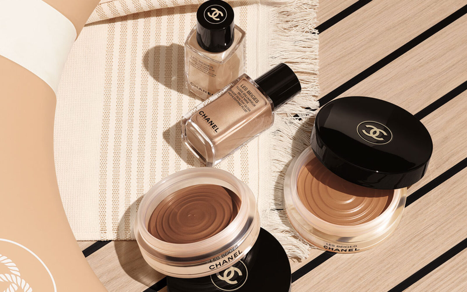 Summer holiday beauty essentials; Chanel Les Beiges collection flatlay