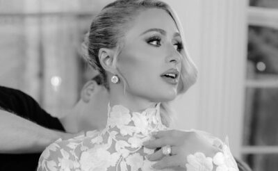 Black and white photo of Paris Hilton wearing her engagement ring at her wedding