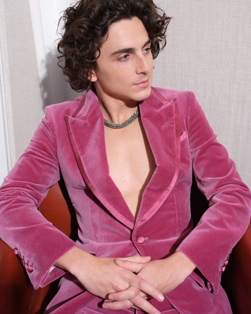 Timothée Chalamet, in character as Willy Wonka, shines at the world premiere in London with his exclusive Cartier necklace